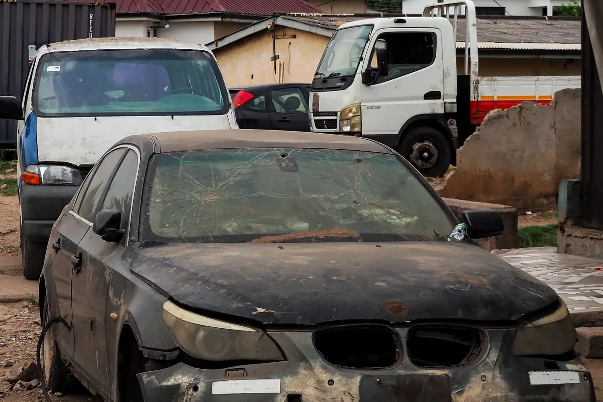 Accident damaged vehicle being recovered onto a flatbed truck