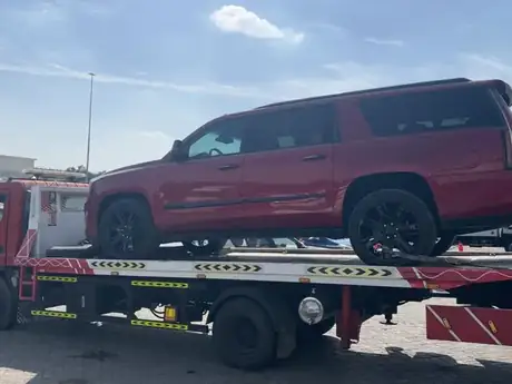 Flatbed tow truck carrying a large SUV — MZ Meer Car Recovery
