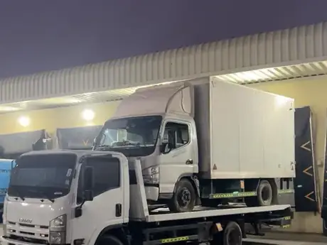 Recovery trucks parked at the depot at night — MZ Meer Car Recovery
