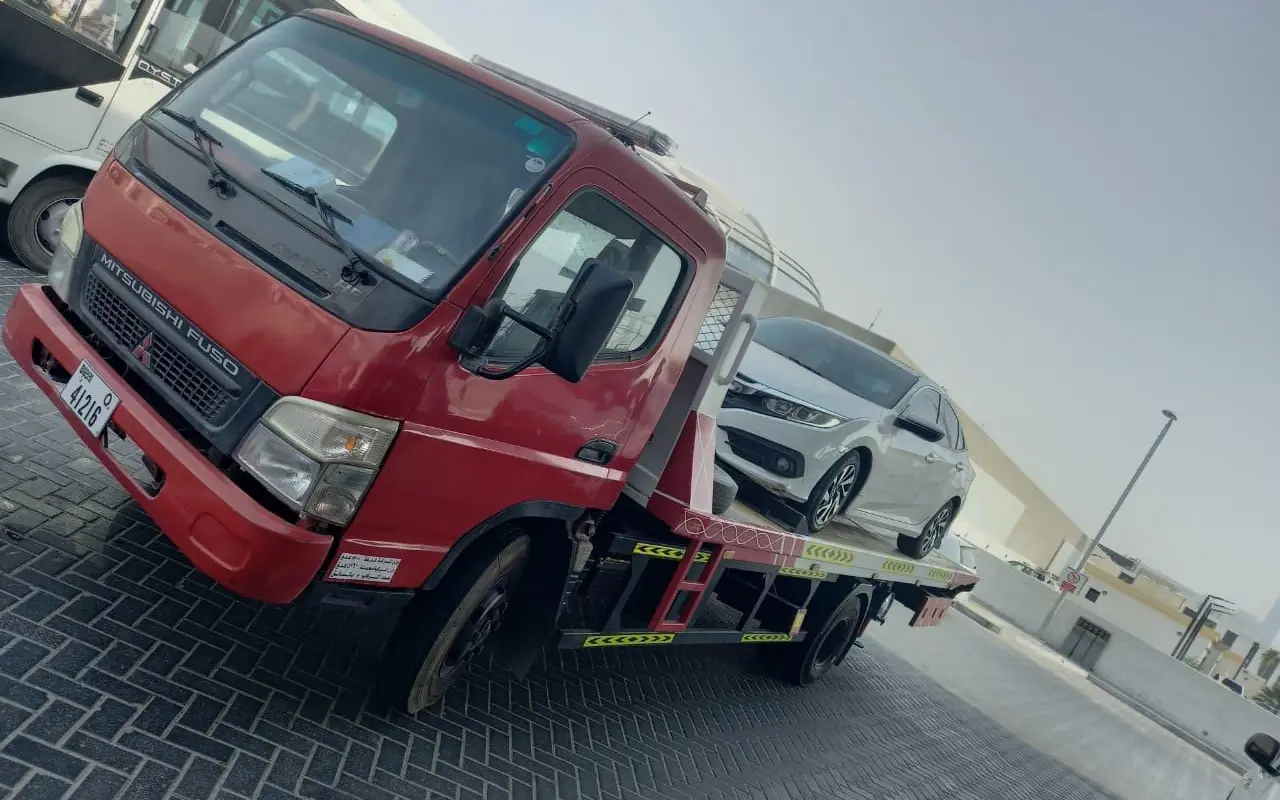 MZ Meer flatbed recovery truck with a vehicle loaded in Dubai