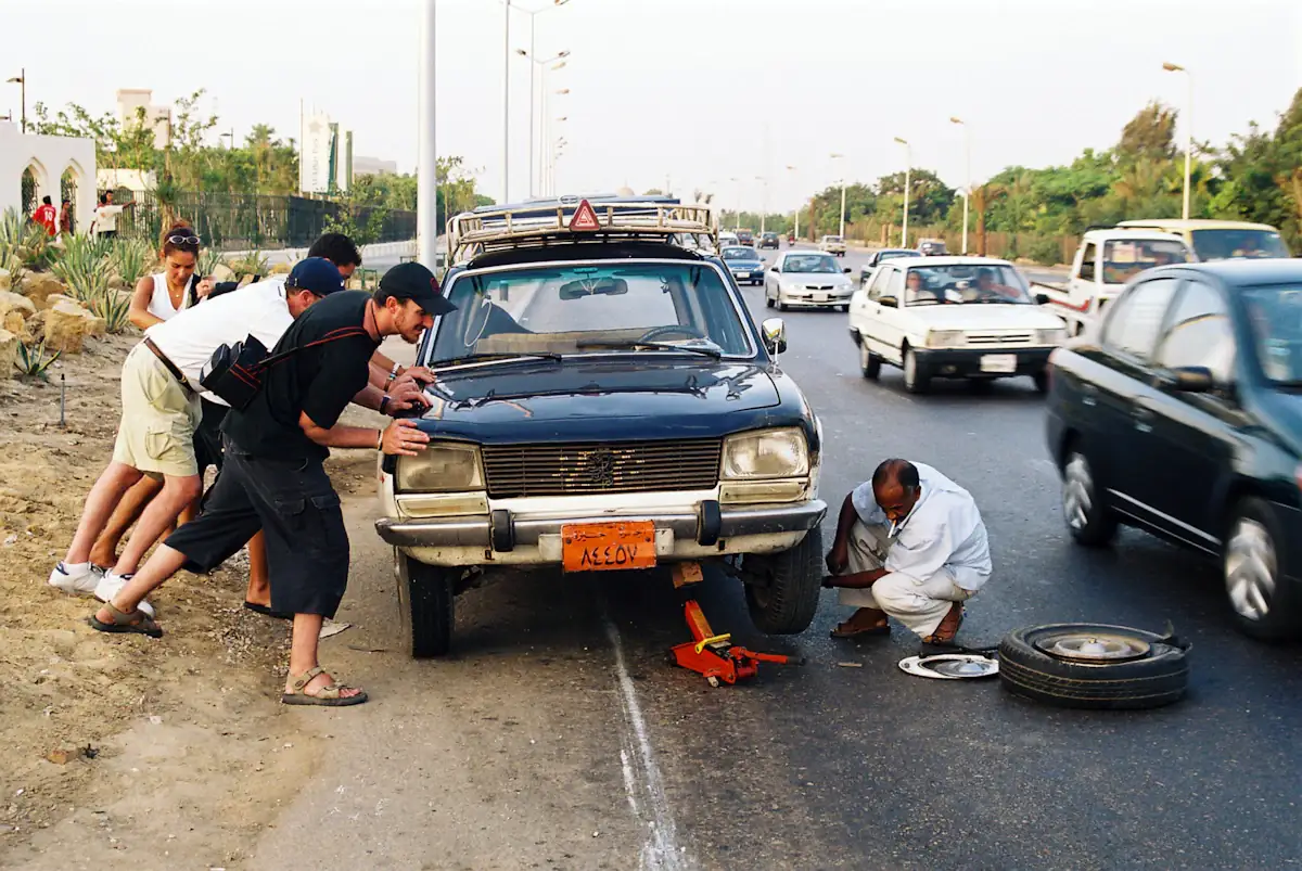 Roadside assistance technician helping a stranded driver